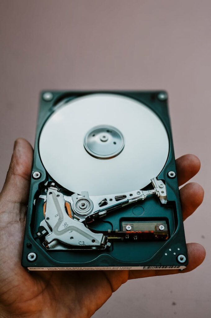 Opened Hard Drive Disk in Hand